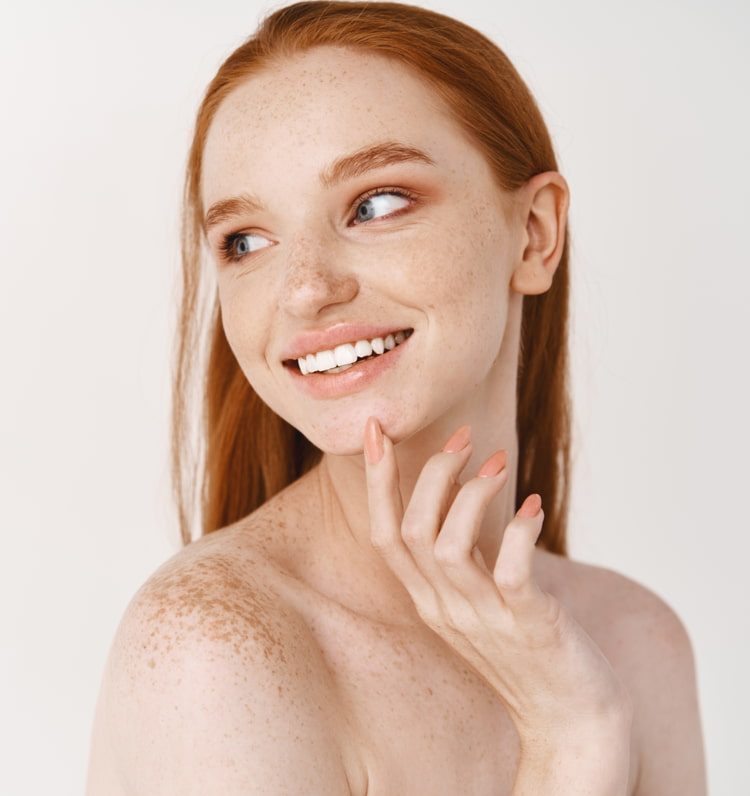 woman with pale skin and freckles