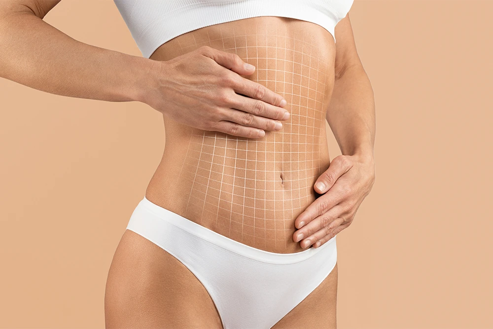 woman touching flat abdomen